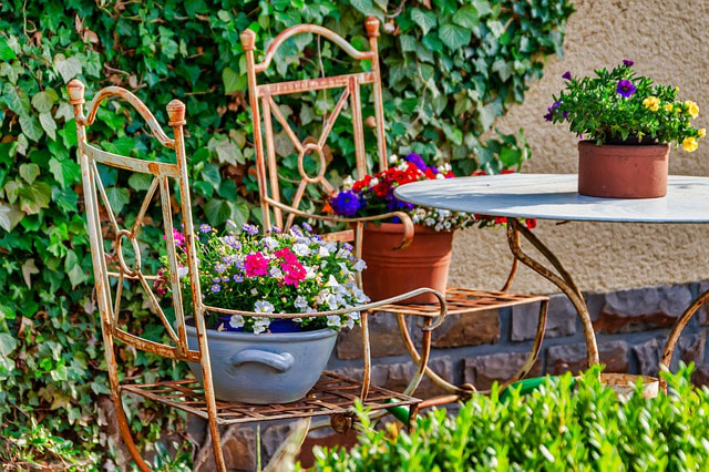 Wrought iron chairs in garden decoration