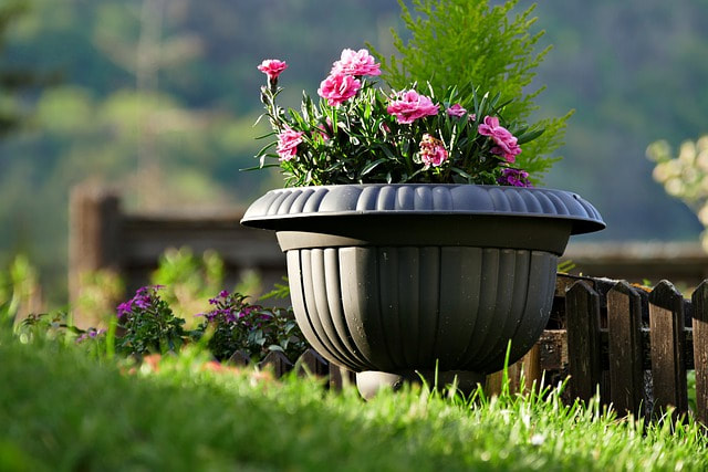 Garden container with flower arrangement